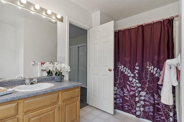 4 Quail Run Dr, Methuen, MA 01844 - full bathroom with tile patterned floors, vanity, and curtained shower