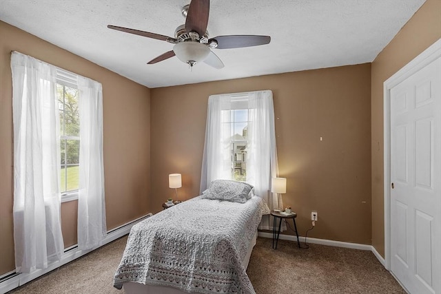 4 Quail Run Dr, Methuen, MA 01844 - carpeted bedroom with baseboards, ceiling fan, and a baseboard heating unit