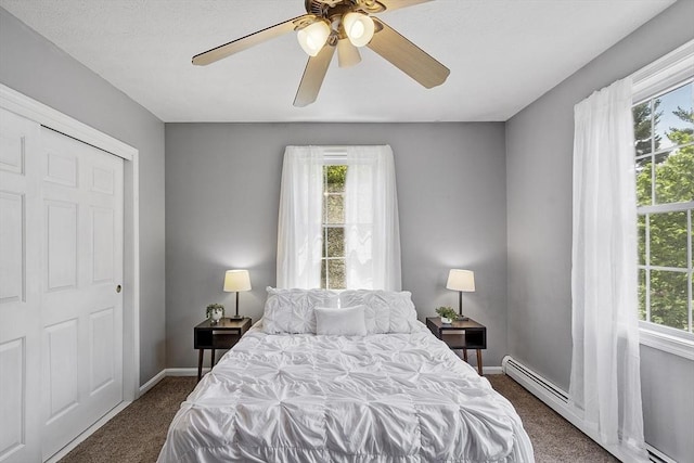 4 Quail Run Dr, Methuen, MA 01844 - carpeted bedroom with a baseboard heating unit, multiple windows, baseboards, and ceiling fan