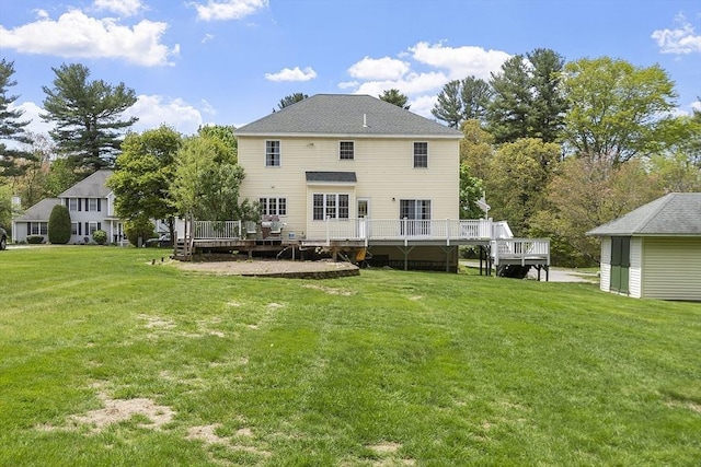 4 Quail Run Dr, Methuen, MA 01844 - back of house with a deck and a lawn