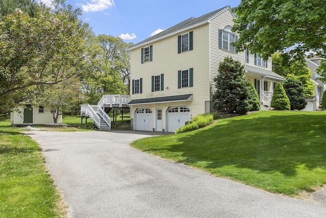 4 Quail Run Dr, Methuen, MA 01844 - view of front facade with driveway, a garage, a front yard, stairway, and an outdoor structure