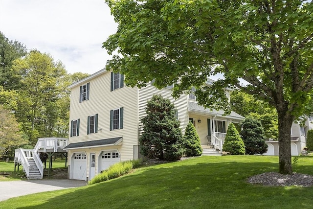 4 Quail Run Dr, Methuen, MA 01844 - view of front of home with a front yard, an attached garage, asphalt driveway, and stairway
