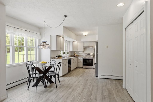 4 Quail Run Dr, Methuen, MA 01844 - dining room featuring a baseboard radiator, light wood finished floors, recessed lighting, and a textured ceiling