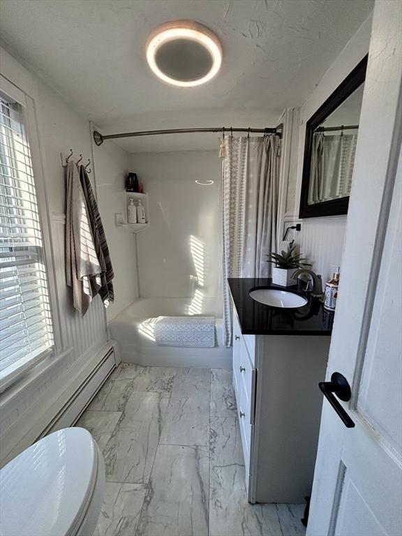 full bathroom with vanity, toilet, and shower / bath combo