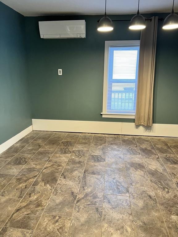 unfurnished room featuring a wall mounted air conditioner