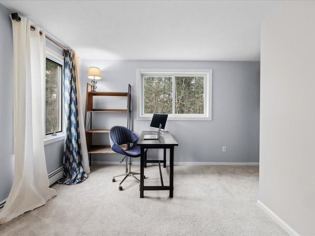 carpeted office space featuring baseboard heating