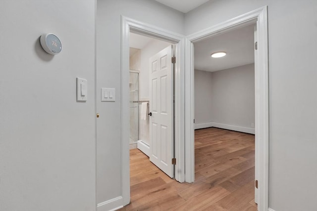 7 Hammond Pond Pkwy Unit 1, Newton, MA 02467 - hallway featuring light wood-style floors and baseboards