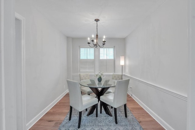 7 Hammond Pond Pkwy Unit 1, Newton, MA 02467 - dining room with wood finished floors, a chandelier, and baseboards