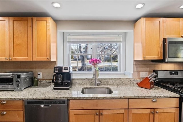 859 Pleasant St, Canton, MA 02021 - kitchen featuring tasteful backsplash, light stone counters, a toaster, stainless steel appliances, and a sink