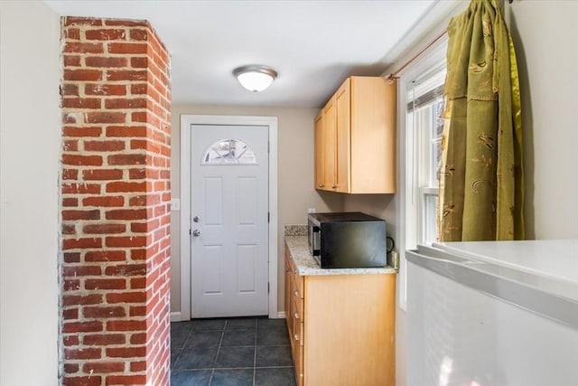 859 Pleasant St, Canton, MA 02021 - interior space with dark tile patterned floors and plenty of natural light