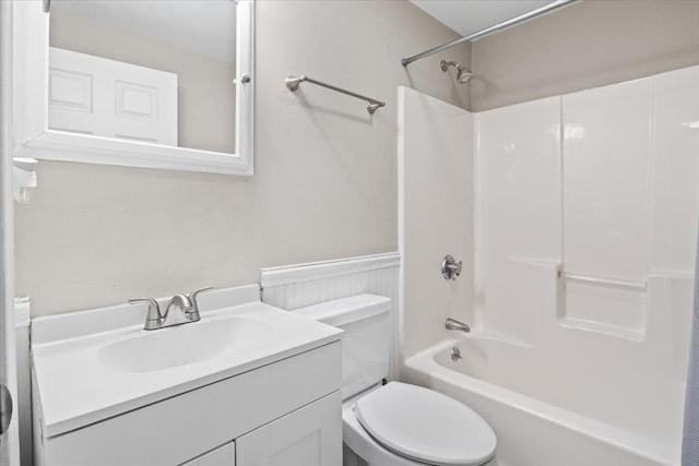 859 Pleasant St, Canton, MA 02021 - full bathroom with toilet, vanity, shower / washtub combination, and a wainscoted wall