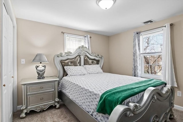 859 Pleasant St, Canton, MA 02021 - bedroom with baseboards, visible vents, and carpet floors