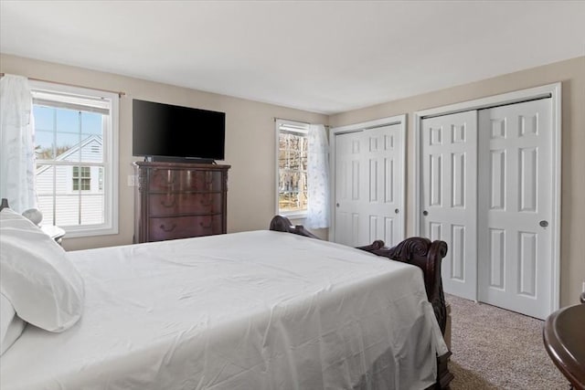 859 Pleasant St, Canton, MA 02021 - carpeted bedroom featuring multiple closets