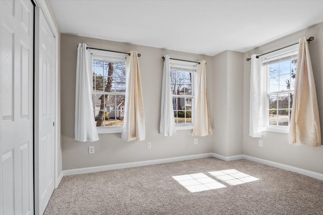 859 Pleasant St, Canton, MA 02021 - unfurnished bedroom with baseboards and carpet floors