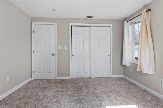 859 Pleasant St, Canton, MA 02021 - unfurnished bedroom featuring a closet, carpet flooring, baseboards, and visible vents