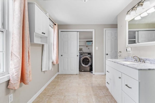 859 Pleasant St, Canton, MA 02021 - laundry room featuring laundry area, light tile patterned floors, washer / clothes dryer, a sink, and baseboards