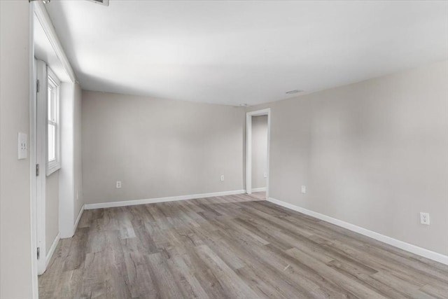 859 Pleasant St, Canton, MA 02021 - spare room featuring baseboards and wood finished floors
