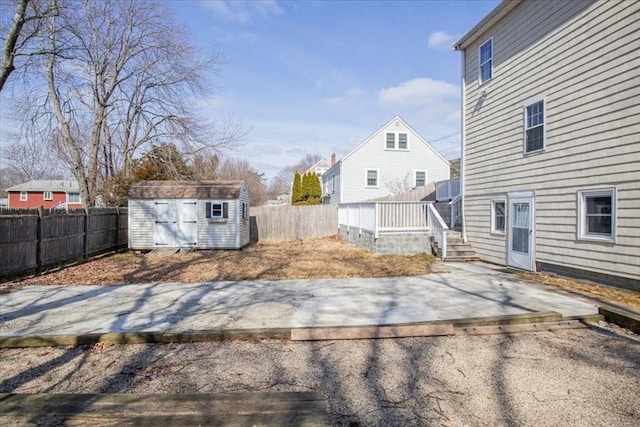859 Pleasant St, Canton, MA 02021 - view of yard featuring an outbuilding, a shed, a fenced backyard, and a patio area