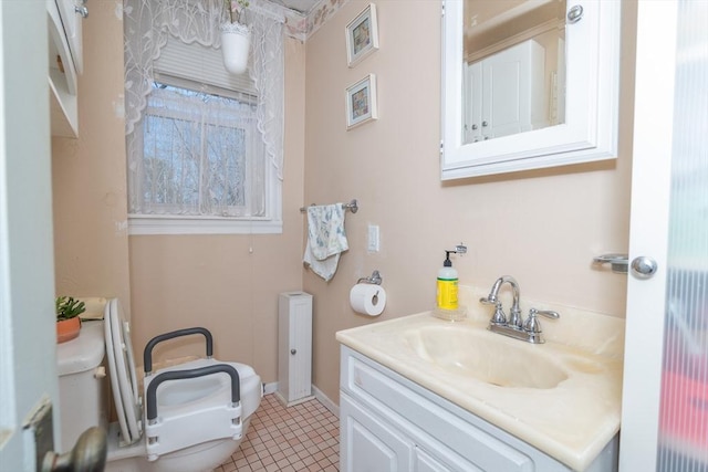 bathroom with tile patterned floors, toilet, and vanity