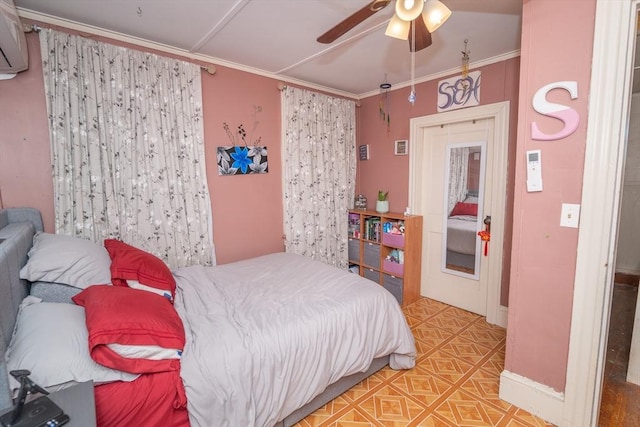 bedroom featuring baseboards, ornamental molding, a ceiling fan, and an AC wall unit