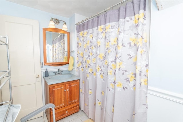 full bathroom featuring tile patterned flooring and vanity