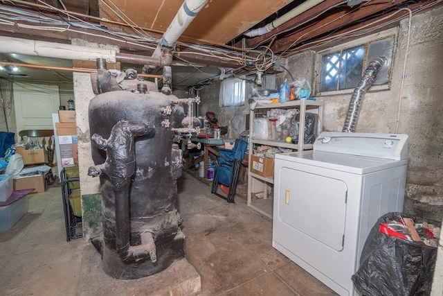 basement with a wealth of natural light and washer / dryer