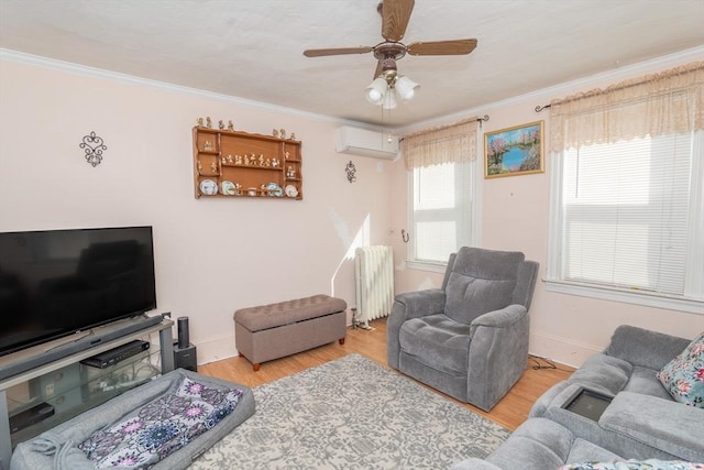 living area featuring wood finished floors, radiator heating unit, ornamental molding, a wall unit AC, and a ceiling fan