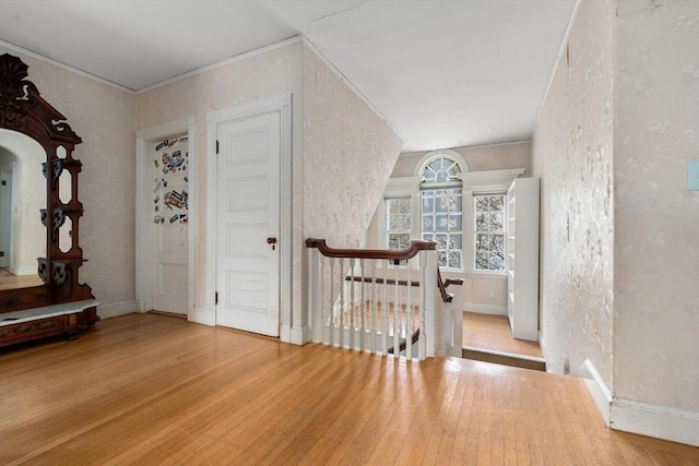 interior space featuring wood finished floors and baseboards