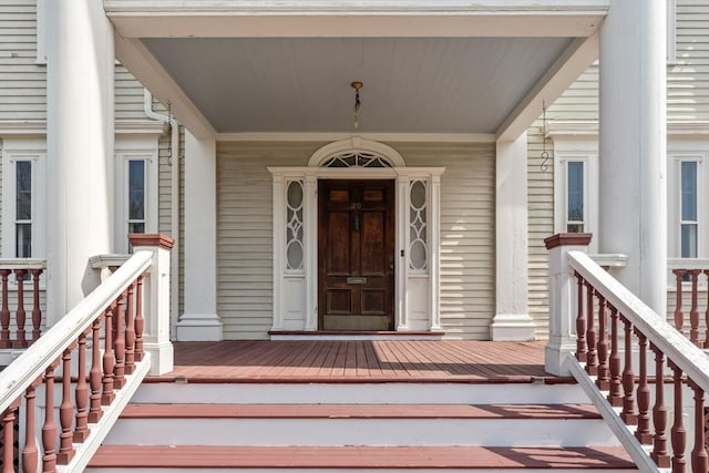 entrance to property featuring a porch
