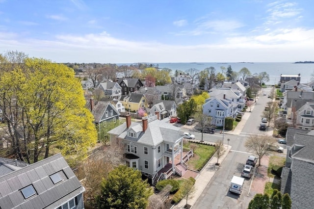bird's eye view with a water view and a residential view