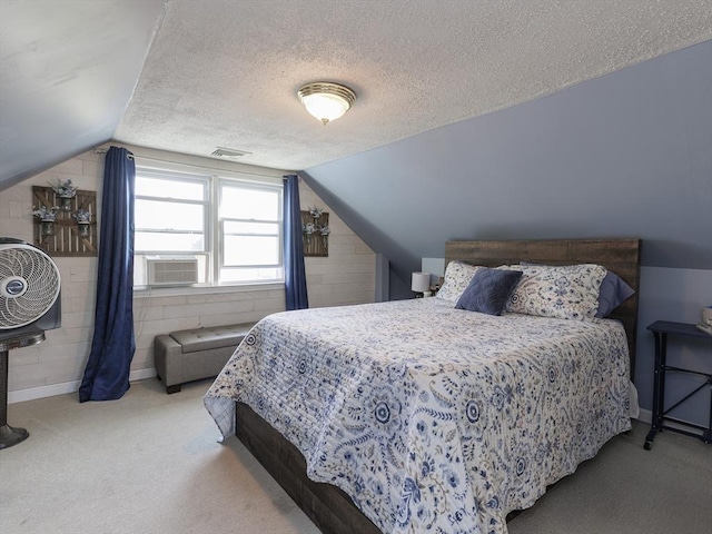 carpeted bedroom with lofted ceiling, cooling unit, a textured ceiling, and baseboards
