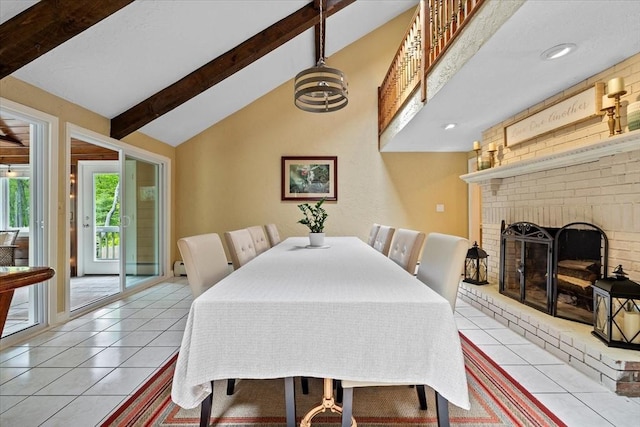 16 Gilbert Way, Millbury, MA 01527 - dining area featuring light tile patterned floors and a brick fireplace