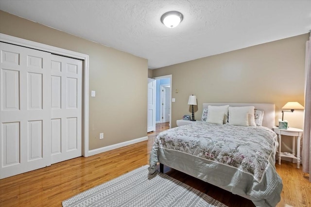 16 Gilbert Way, Millbury, MA 01527 - bedroom featuring wood finished floors, a textured ceiling, and baseboards