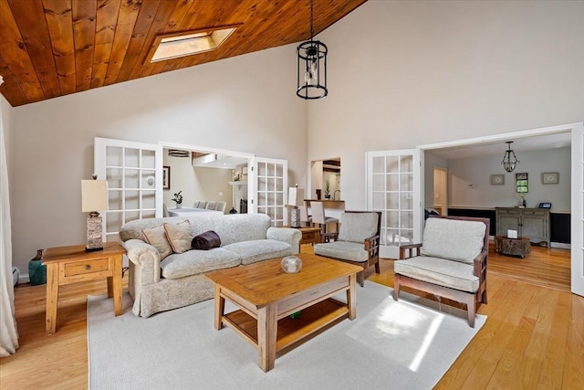 16 Gilbert Way, Millbury, MA 01527 - living room with french doors, high vaulted ceiling, light wood-type flooring, and wood ceiling