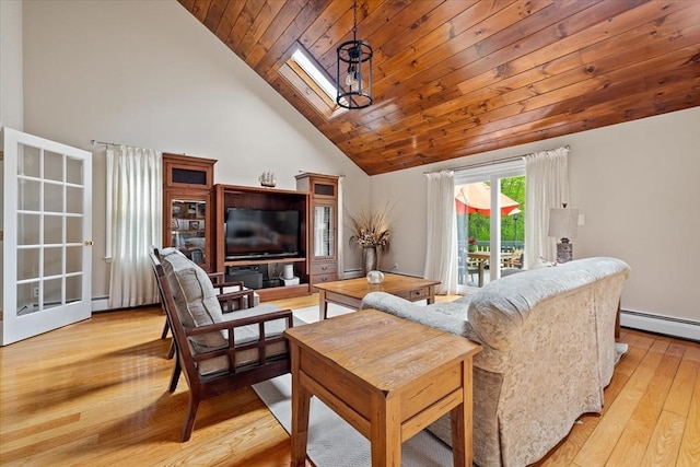 16 Gilbert Way, Millbury, MA 01527 - living area with a skylight, high vaulted ceiling, a baseboard heating unit, light wood-type flooring, and wooden ceiling
