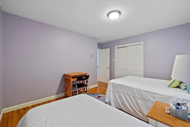 16 Gilbert Way, Millbury, MA 01527 - bedroom with baseboards, wood finished floors, and a closet