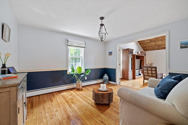 16 Gilbert Way, Millbury, MA 01527 - living room featuring light wood finished floors, a baseboard heating unit, and baseboards