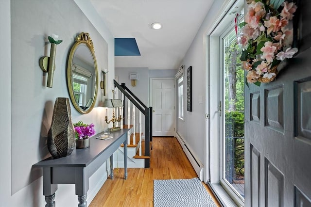 16 Gilbert Way, Millbury, MA 01527 - foyer with baseboard heating, plenty of natural light, light wood-type flooring, baseboards, and recessed lighting
