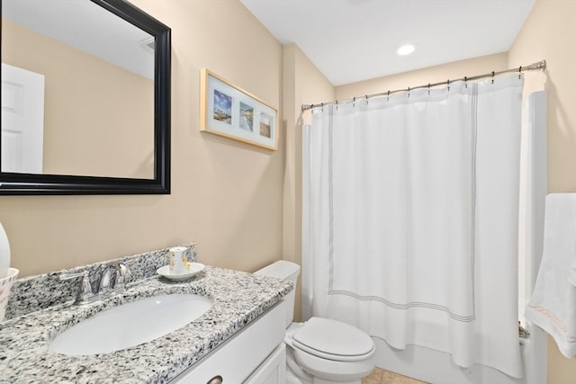 full bathroom featuring tile patterned flooring, vanity, toilet, and shower / tub combo with curtain