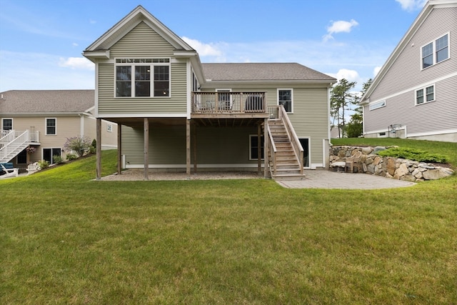 back of house with a patio area, a yard, and a deck