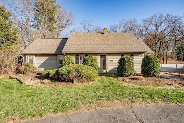 single story home with a front yard