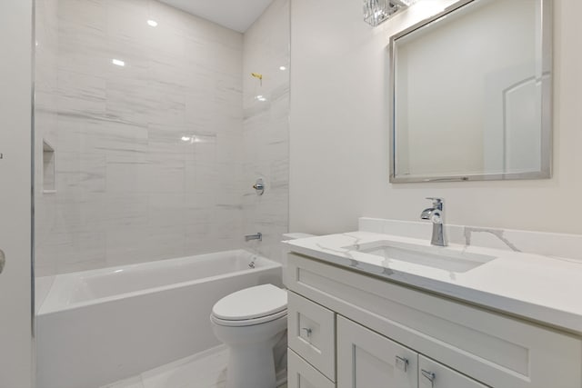 full bathroom with toilet, vanity, and tiled shower / bath