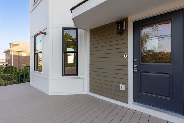 view of exterior entry with covered porch