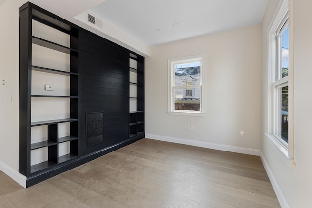 empty room with light hardwood / wood-style floors