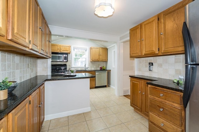 6 Gilbert Rd, Natick, MA 01760 - kitchen featuring stainless steel appliances, backsplash, light tile patterned floors, and brown cabinetry