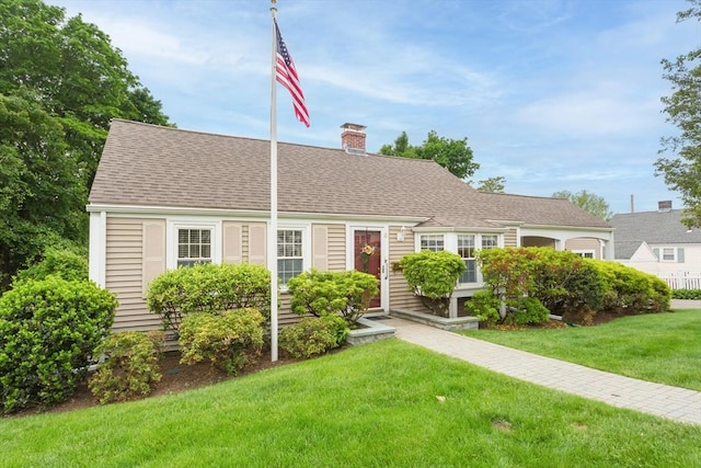 6 Gilbert Rd, Natick, MA 01760 - view of front of home featuring a chimney and a front yard