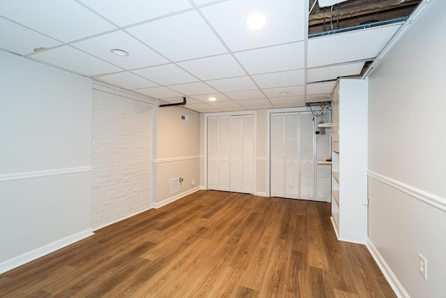 6 Gilbert Rd, Natick, MA 01760 - unfurnished bedroom featuring wood finished floors, baseboards, multiple closets, a drop ceiling, and recessed lighting