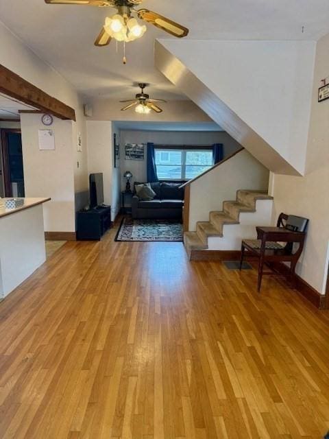14 Pequot Rd, Weymouth, MA 02191 - living room featuring light wood-type flooring, ceiling fan, stairs, and baseboards