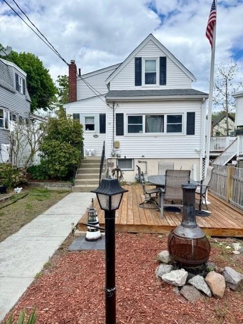 14 Pequot Rd, Weymouth, MA 02191 - rear view of property featuring a deck, an outdoor fire pit, stairs, and outdoor dining area
