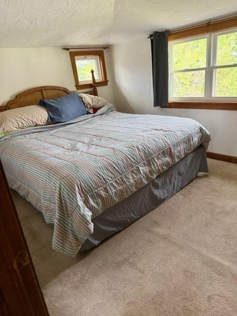 14 Pequot Rd, Weymouth, MA 02191 - carpeted bedroom with a textured ceiling and baseboards